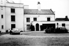 Aspley_Hall_-_east_side_with_main_entrance_and_Jenson_car_in_drive_c_1955
