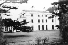 Aspley_Hall_-_south_and_west_side_showing_sitting_and_dining_rooms_plus_conservatory__Ha_Ha_c_1955
