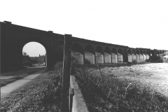 Awsworth_-_Viaduct_-_central_arch_with_village_beyond._Broken_parapet_visible