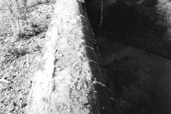 Awsworth_-_Viaduct_-_derelict_the_damaged_parapet_and_weed_covered_trackway