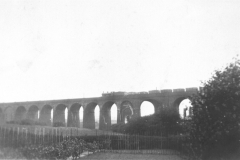 Awsworth_-_Viaduct_built_1871_view_along_its_length_with_coal_train_crossing_1930s_bw