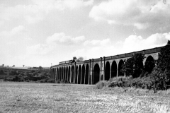 Awsworth_-_Viaduct_built_1871_view_from_across_the_fields_with_passenger_train_crossing_1960s