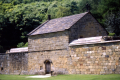 Beauvale_Priory_-_Reconstructed_cell_Mount_Grace_N._Yorks_note_food_hatch_to_left_of_door_colour_1996