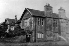 Broxtowe_-_Broxtowe_Hall_-_Walter_Bramley_aged_about_15_outside_building_on_northeast_side