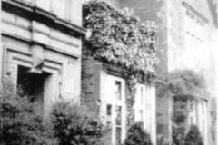 Broxtowe_-_Broxtowe_Hall_-_front_door_and_part_of_front_garden_with_2_bushes_and_a_bay