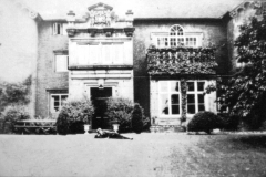Broxtowe_-_Broxtowe_Hall_-_front_garden__Walter_Bramley_lying_down_c_1928